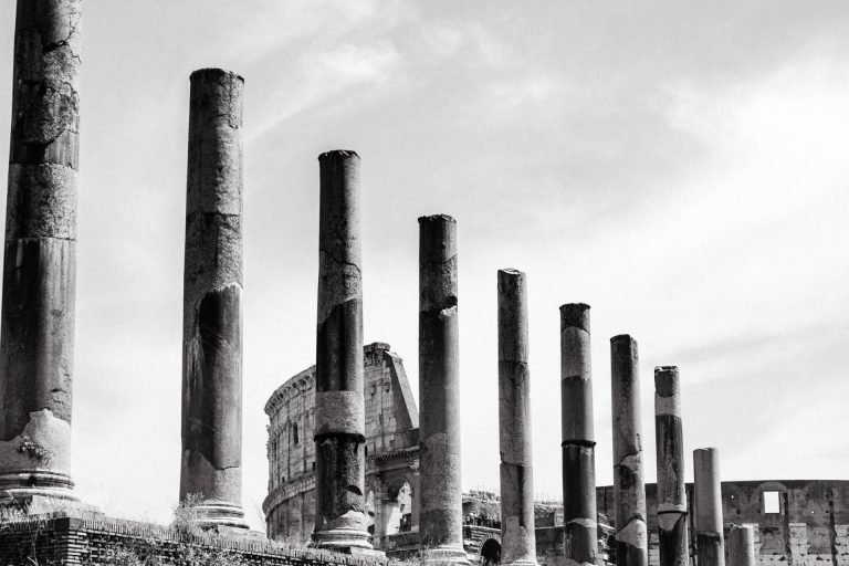 The road from forum romanum to the colosseum lined with pillars