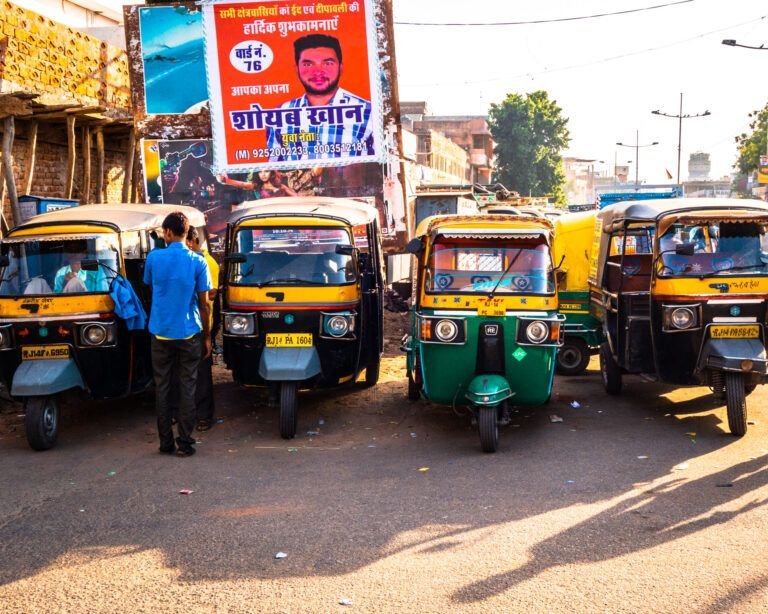 Four street taxis awaiting clients on the streets of jaipur