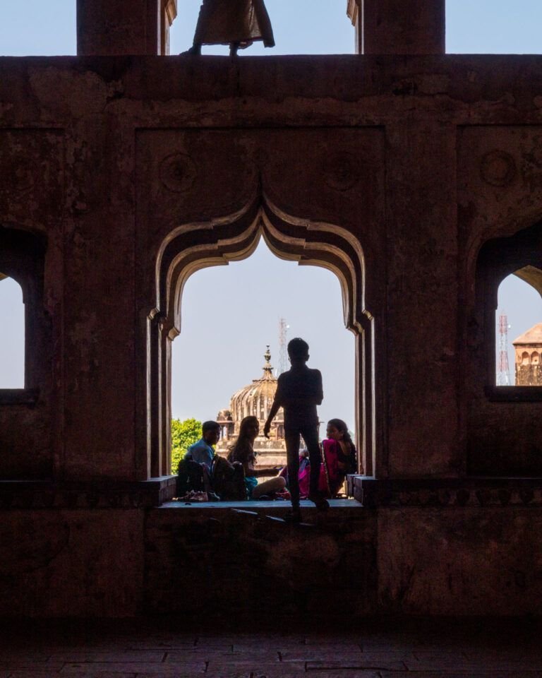 Silhouette's against the palace background